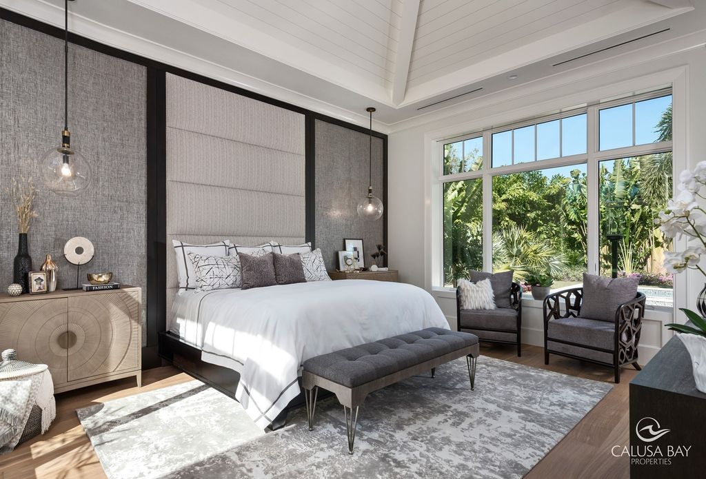 The Contemporary Home is perfectly complemented by lush mature tropical landscaping in the heart of Pelican Bay now available for sale. This home located at 810 Bentwood Dr, Naples, Florida; offering 4 bedrooms and 6 bathrooms with over 4,600 square feet of living spaces.