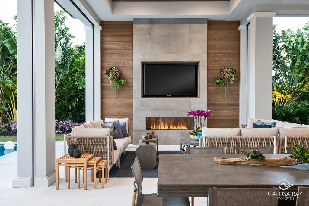 The Contemporary Home is perfectly complemented by lush mature tropical landscaping in the heart of Pelican Bay now available for sale. This home located at 810 Bentwood Dr, Naples, Florida; offering 4 bedrooms and 6 bathrooms with over 4,600 square feet of living spaces.