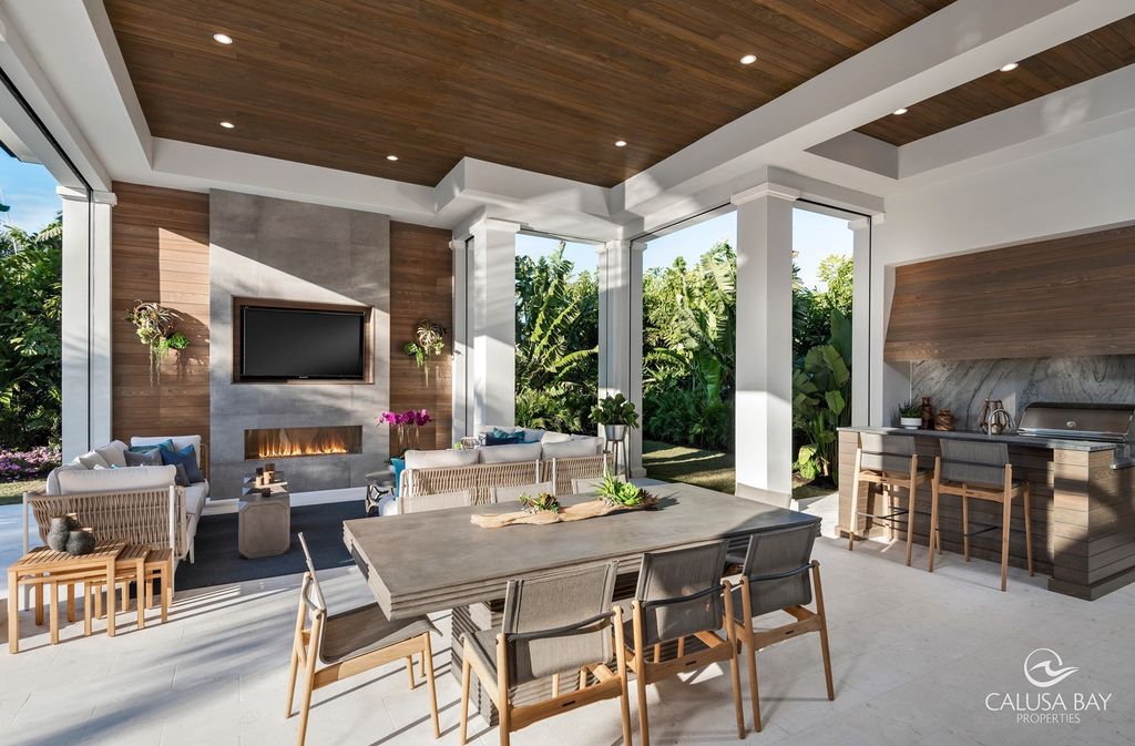 The Contemporary Home is perfectly complemented by lush mature tropical landscaping in the heart of Pelican Bay now available for sale. This home located at 810 Bentwood Dr, Naples, Florida; offering 4 bedrooms and 6 bathrooms with over 4,600 square feet of living spaces.