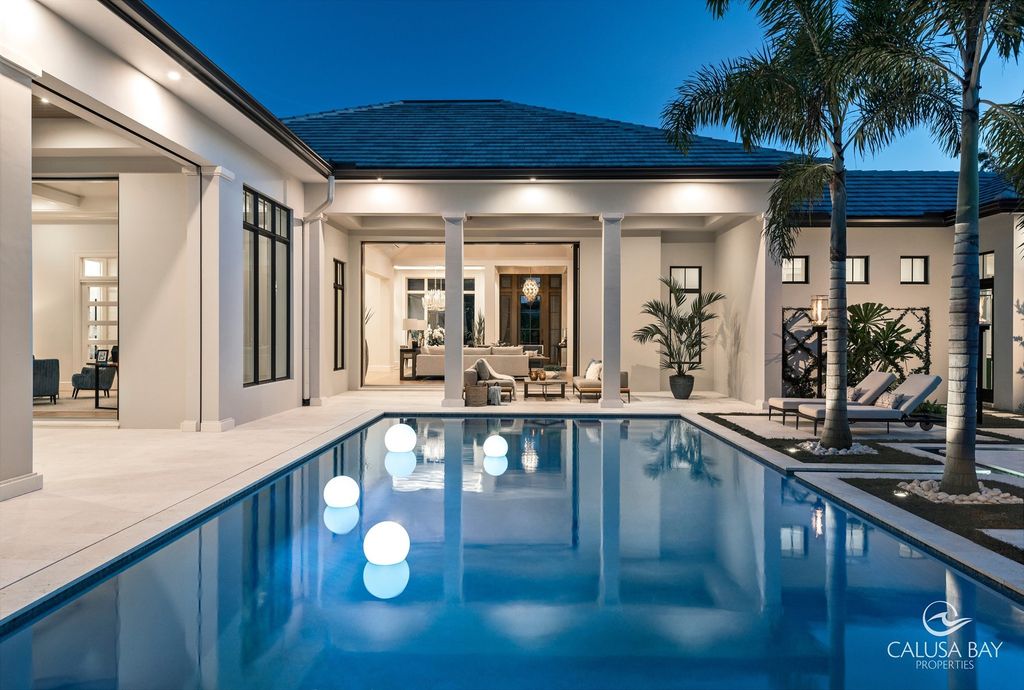 The Contemporary Home is perfectly complemented by lush mature tropical landscaping in the heart of Pelican Bay now available for sale. This home located at 810 Bentwood Dr, Naples, Florida; offering 4 bedrooms and 6 bathrooms with over 4,600 square feet of living spaces.