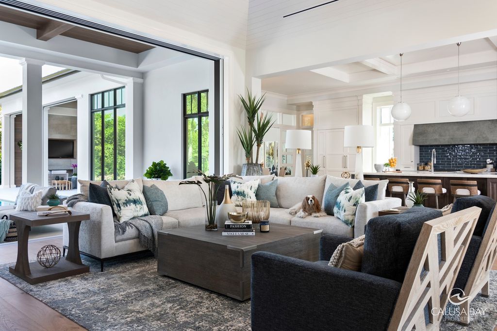 The Contemporary Home is perfectly complemented by lush mature tropical landscaping in the heart of Pelican Bay now available for sale. This home located at 810 Bentwood Dr, Naples, Florida; offering 4 bedrooms and 6 bathrooms with over 4,600 square feet of living spaces.