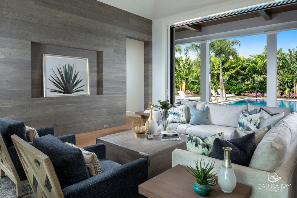 The Contemporary Home is perfectly complemented by lush mature tropical landscaping in the heart of Pelican Bay now available for sale. This home located at 810 Bentwood Dr, Naples, Florida; offering 4 bedrooms and 6 bathrooms with over 4,600 square feet of living spaces.