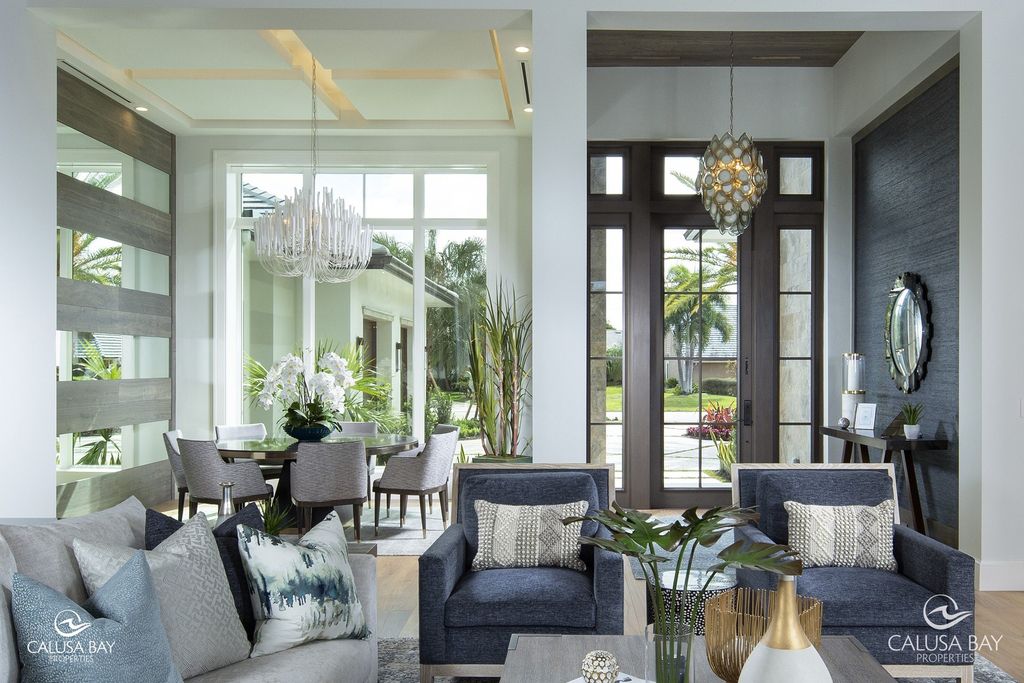 The Contemporary Home is perfectly complemented by lush mature tropical landscaping in the heart of Pelican Bay now available for sale. This home located at 810 Bentwood Dr, Naples, Florida; offering 4 bedrooms and 6 bathrooms with over 4,600 square feet of living spaces.