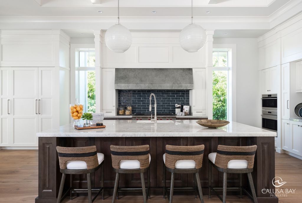 The Contemporary Home is perfectly complemented by lush mature tropical landscaping in the heart of Pelican Bay now available for sale. This home located at 810 Bentwood Dr, Naples, Florida; offering 4 bedrooms and 6 bathrooms with over 4,600 square feet of living spaces.