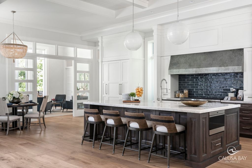 The Contemporary Home is perfectly complemented by lush mature tropical landscaping in the heart of Pelican Bay now available for sale. This home located at 810 Bentwood Dr, Naples, Florida; offering 4 bedrooms and 6 bathrooms with over 4,600 square feet of living spaces.