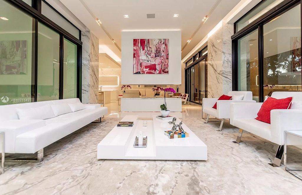 The Resort Style Mansion in Miami Beach is a newly luxurious home with sunsets over the Miami skyline on prestigious North bay road now available for sale. This home located at 5004 N Bay Rd, Miami Beach, Florida; offering 8 bedrooms and 10 bathrooms with over 12,800 square feet of living spaces. 