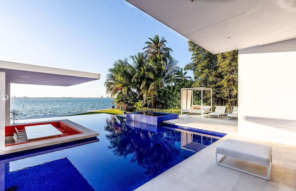 The Resort Style Mansion in Miami Beach is a newly luxurious home with sunsets over the Miami skyline on prestigious North bay road now available for sale. This home located at 5004 N Bay Rd, Miami Beach, Florida; offering 8 bedrooms and 10 bathrooms with over 12,800 square feet of living spaces. 