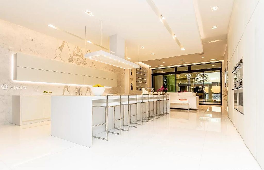The Resort Style Mansion in Miami Beach is a newly luxurious home with sunsets over the Miami skyline on prestigious North bay road now available for sale. This home located at 5004 N Bay Rd, Miami Beach, Florida; offering 8 bedrooms and 10 bathrooms with over 12,800 square feet of living spaces. 