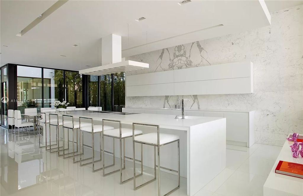 The Resort Style Mansion in Miami Beach is a newly luxurious home with sunsets over the Miami skyline on prestigious North bay road now available for sale. This home located at 5004 N Bay Rd, Miami Beach, Florida; offering 8 bedrooms and 10 bathrooms with over 12,800 square feet of living spaces. 