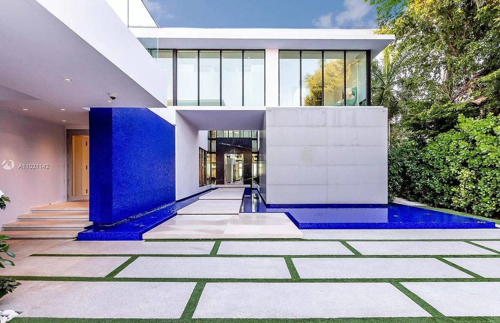 The Resort Style Mansion in Miami Beach is a newly luxurious home with sunsets over the Miami skyline on prestigious North bay road now available for sale. This home located at 5004 N Bay Rd, Miami Beach, Florida; offering 8 bedrooms and 10 bathrooms with over 12,800 square feet of living spaces. 