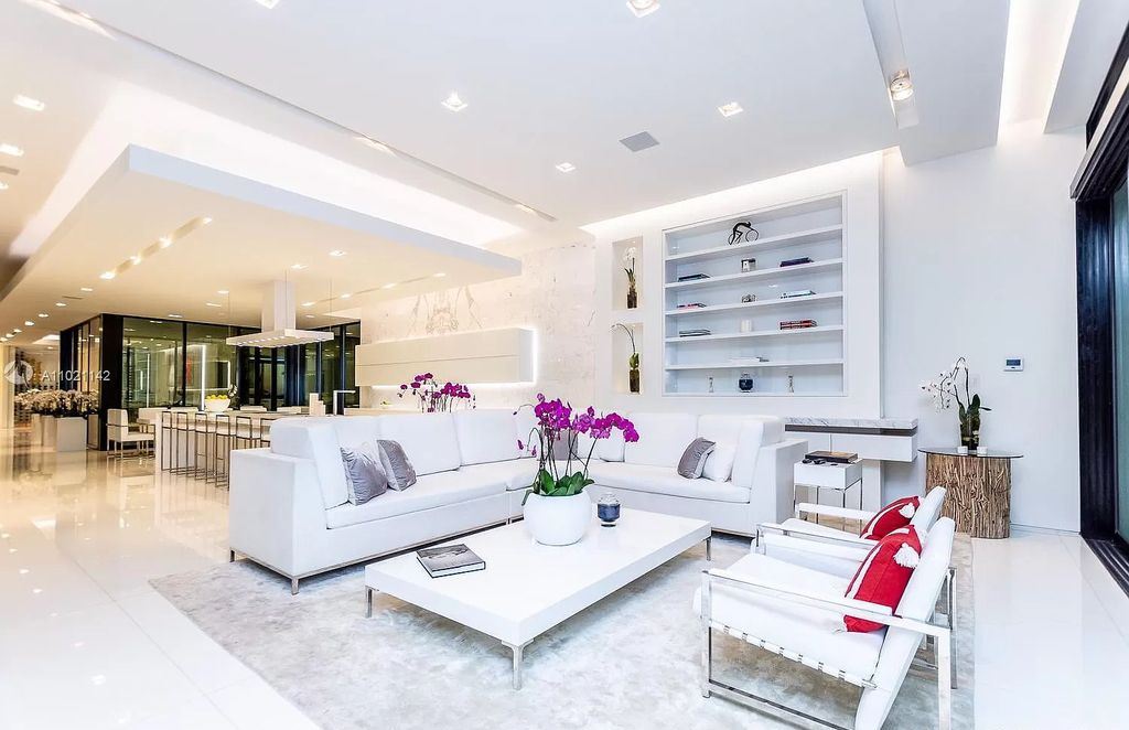 The Resort Style Mansion in Miami Beach is a newly luxurious home with sunsets over the Miami skyline on prestigious North bay road now available for sale. This home located at 5004 N Bay Rd, Miami Beach, Florida; offering 8 bedrooms and 10 bathrooms with over 12,800 square feet of living spaces. 