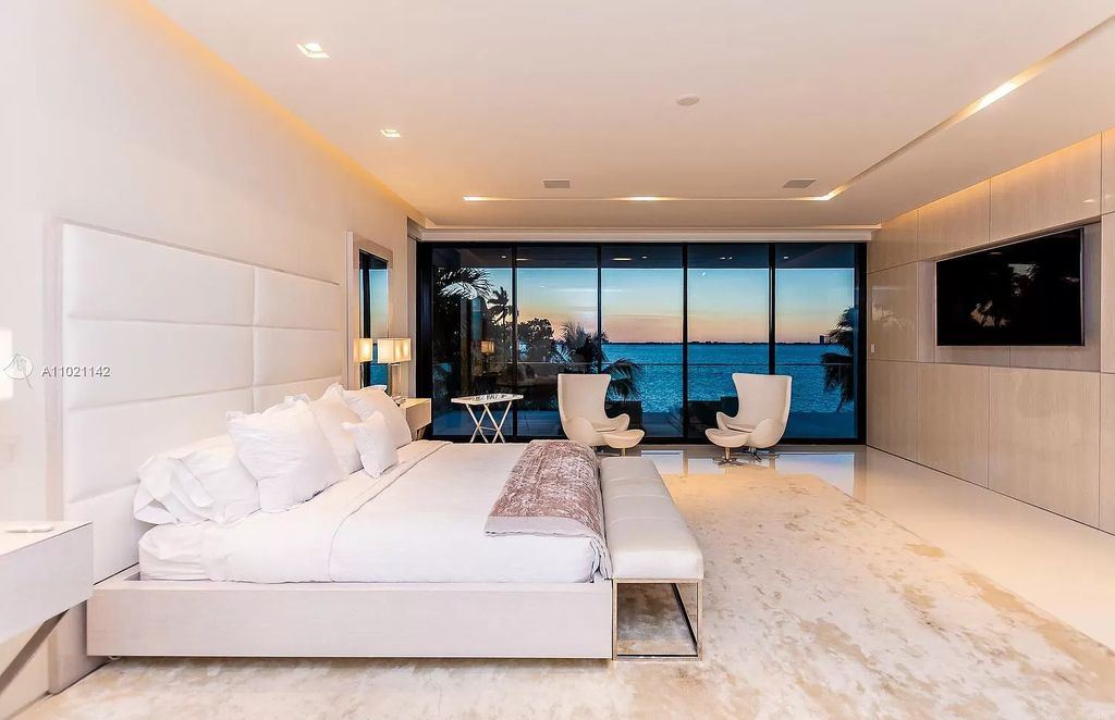 The Resort Style Mansion in Miami Beach is a newly luxurious home with sunsets over the Miami skyline on prestigious North bay road now available for sale. This home located at 5004 N Bay Rd, Miami Beach, Florida; offering 8 bedrooms and 10 bathrooms with over 12,800 square feet of living spaces. 