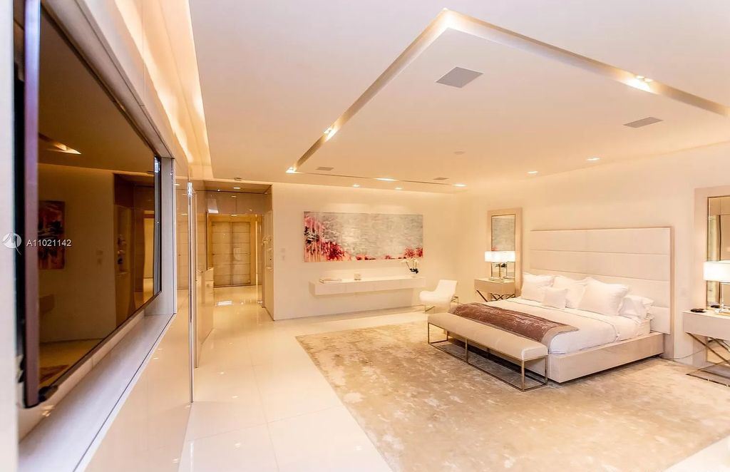 The Resort Style Mansion in Miami Beach is a newly luxurious home with sunsets over the Miami skyline on prestigious North bay road now available for sale. This home located at 5004 N Bay Rd, Miami Beach, Florida; offering 8 bedrooms and 10 bathrooms with over 12,800 square feet of living spaces. 