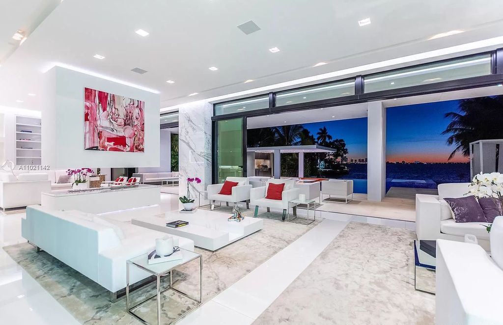 The Resort Style Mansion in Miami Beach is a newly luxurious home with sunsets over the Miami skyline on prestigious North bay road now available for sale. This home located at 5004 N Bay Rd, Miami Beach, Florida; offering 8 bedrooms and 10 bathrooms with over 12,800 square feet of living spaces. 