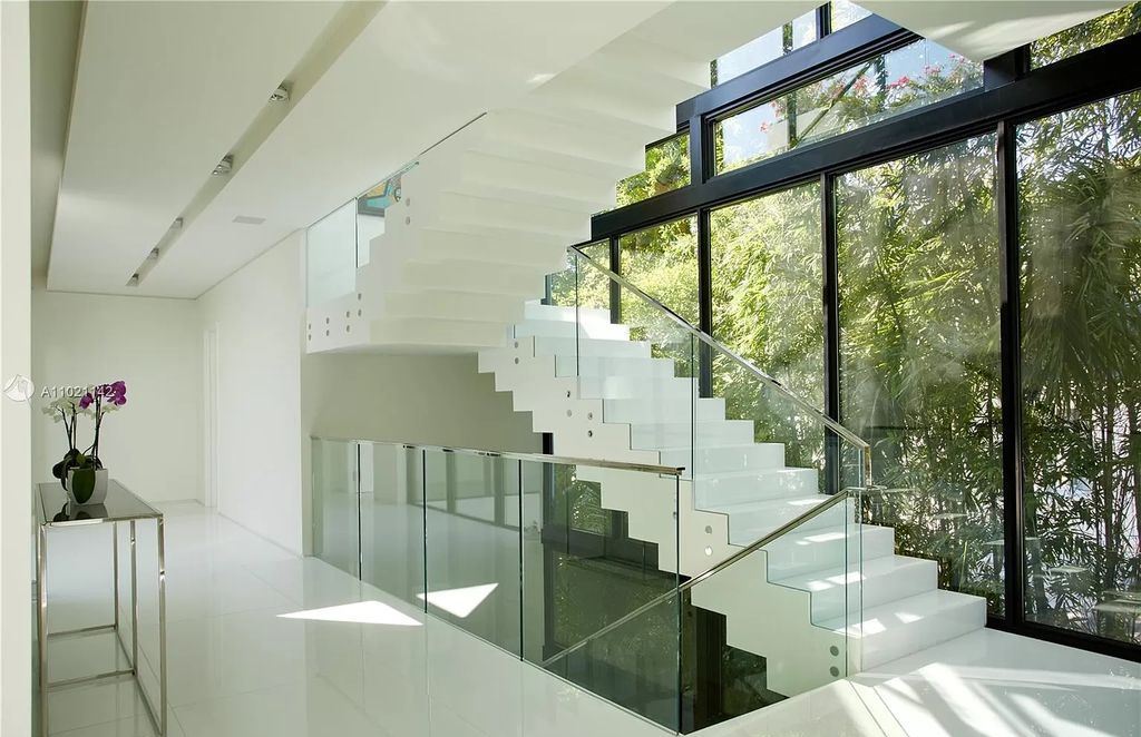 The Resort Style Mansion in Miami Beach is a newly luxurious home with sunsets over the Miami skyline on prestigious North bay road now available for sale. This home located at 5004 N Bay Rd, Miami Beach, Florida; offering 8 bedrooms and 10 bathrooms with over 12,800 square feet of living spaces. 