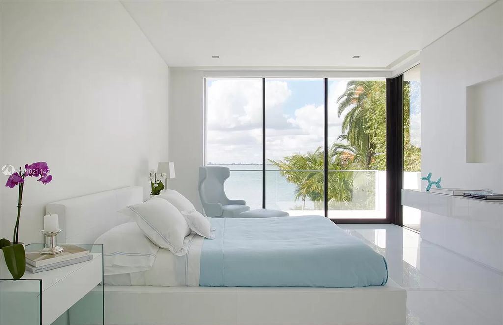 The Resort Style Mansion in Miami Beach is a newly luxurious home with sunsets over the Miami skyline on prestigious North bay road now available for sale. This home located at 5004 N Bay Rd, Miami Beach, Florida; offering 8 bedrooms and 10 bathrooms with over 12,800 square feet of living spaces. 
