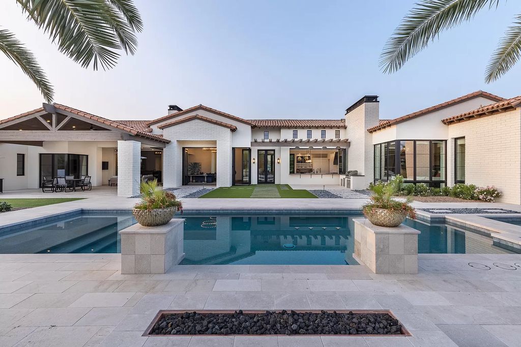 The Modern Hacienda in Coveted Paradise Valley is a luxurious custom home with remarkable quality & workmanship now available for sale. This home located at 5353 E Sanna St, Paradise Valley, Arizona; offering 5 bedrooms and 6 bathrooms with over 6,600 square feet of living spaces.