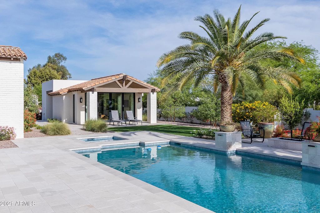 The Modern Hacienda in Coveted Paradise Valley is a luxurious custom home with remarkable quality & workmanship now available for sale. This home located at 5353 E Sanna St, Paradise Valley, Arizona; offering 5 bedrooms and 6 bathrooms with over 6,600 square feet of living spaces.