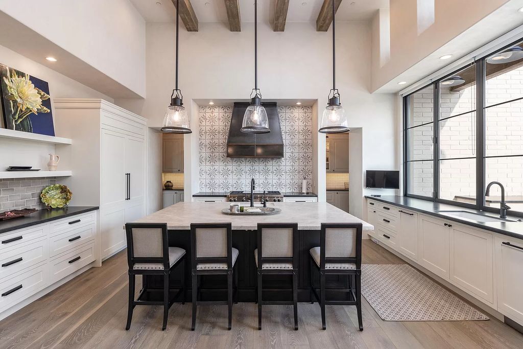 The Modern Hacienda in Coveted Paradise Valley is a luxurious custom home with remarkable quality & workmanship now available for sale. This home located at 5353 E Sanna St, Paradise Valley, Arizona; offering 5 bedrooms and 6 bathrooms with over 6,600 square feet of living spaces.