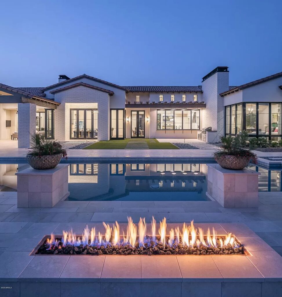 The Modern Hacienda in Coveted Paradise Valley is a luxurious custom home with remarkable quality & workmanship now available for sale. This home located at 5353 E Sanna St, Paradise Valley, Arizona; offering 5 bedrooms and 6 bathrooms with over 6,600 square feet of living spaces.
