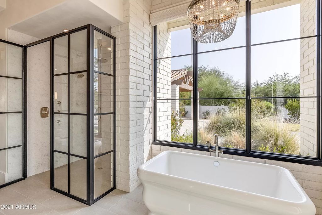 The Modern Hacienda in Coveted Paradise Valley is a luxurious custom home with remarkable quality & workmanship now available for sale. This home located at 5353 E Sanna St, Paradise Valley, Arizona; offering 5 bedrooms and 6 bathrooms with over 6,600 square feet of living spaces.
