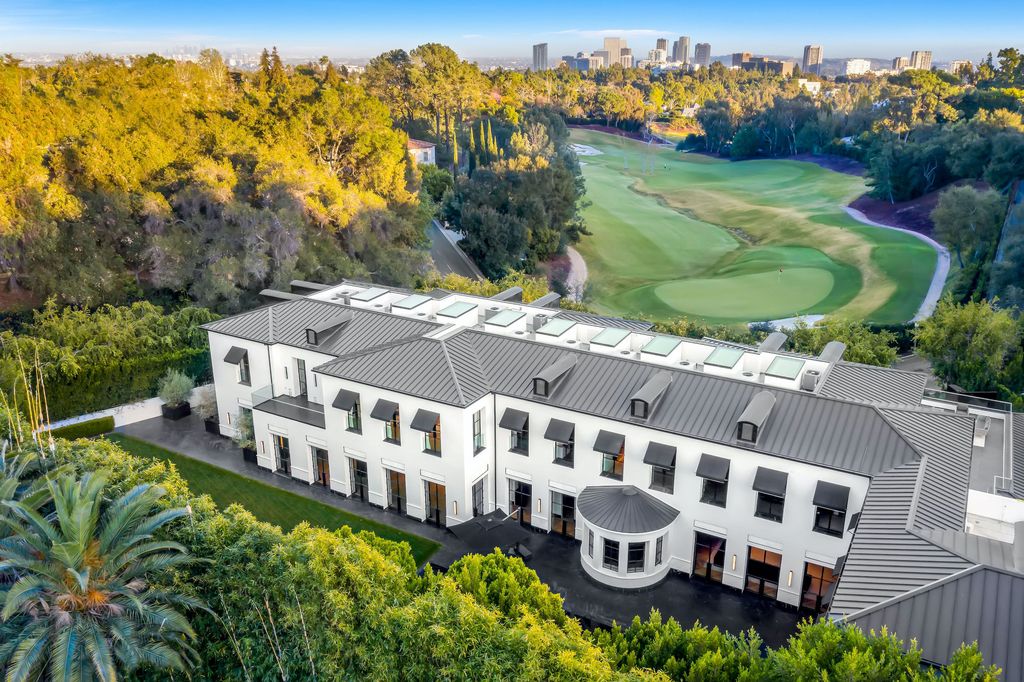 The World Class Trophy Mansion in Los Angeles is a warm contemporary French Manor set in the heart of Old Bel Air now available for sale. This home located at 10701 Bellagio Rd, Los Angeles, California; offering 8 bedrooms and 12 bathrooms with over 24,000 square feet of living spaces.