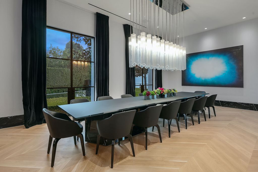 The World Class Trophy Mansion in Los Angeles is a warm contemporary French Manor set in the heart of Old Bel Air now available for sale. This home located at 10701 Bellagio Rd, Los Angeles, California; offering 8 bedrooms and 12 bathrooms with over 24,000 square feet of living spaces.