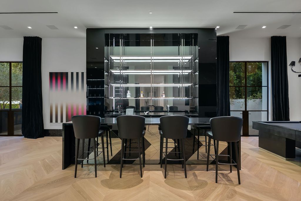 The World Class Trophy Mansion in Los Angeles is a warm contemporary French Manor set in the heart of Old Bel Air now available for sale. This home located at 10701 Bellagio Rd, Los Angeles, California; offering 8 bedrooms and 12 bathrooms with over 24,000 square feet of living spaces.