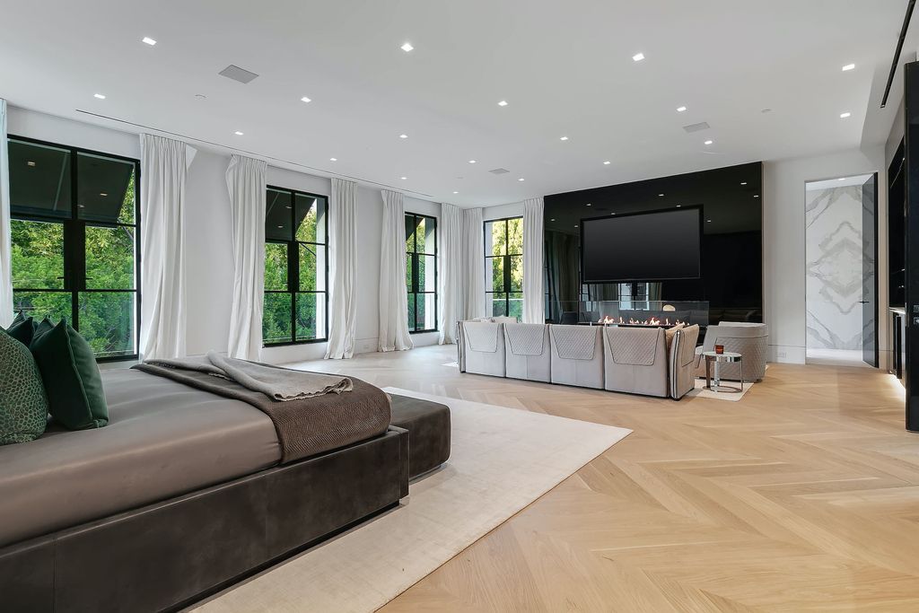 The World Class Trophy Mansion in Los Angeles is a warm contemporary French Manor set in the heart of Old Bel Air now available for sale. This home located at 10701 Bellagio Rd, Los Angeles, California; offering 8 bedrooms and 12 bathrooms with over 24,000 square feet of living spaces.