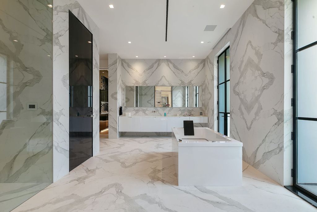 The World Class Trophy Mansion in Los Angeles is a warm contemporary French Manor set in the heart of Old Bel Air now available for sale. This home located at 10701 Bellagio Rd, Los Angeles, California; offering 8 bedrooms and 12 bathrooms with over 24,000 square feet of living spaces.