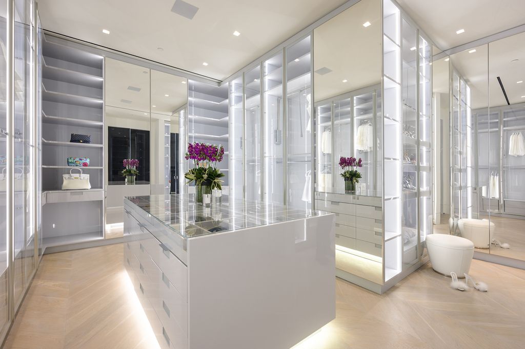 The World Class Trophy Mansion in Los Angeles is a warm contemporary French Manor set in the heart of Old Bel Air now available for sale. This home located at 10701 Bellagio Rd, Los Angeles, California; offering 8 bedrooms and 12 bathrooms with over 24,000 square feet of living spaces.