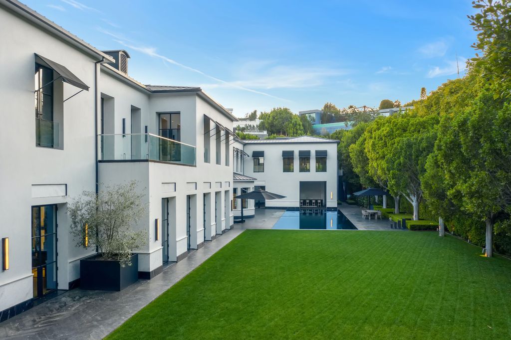 The World Class Trophy Mansion in Los Angeles is a warm contemporary French Manor set in the heart of Old Bel Air now available for sale. This home located at 10701 Bellagio Rd, Los Angeles, California; offering 8 bedrooms and 12 bathrooms with over 24,000 square feet of living spaces.