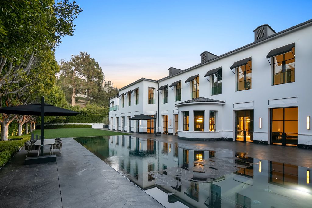 The World Class Trophy Mansion in Los Angeles is a warm contemporary French Manor set in the heart of Old Bel Air now available for sale. This home located at 10701 Bellagio Rd, Los Angeles, California; offering 8 bedrooms and 12 bathrooms with over 24,000 square feet of living spaces.