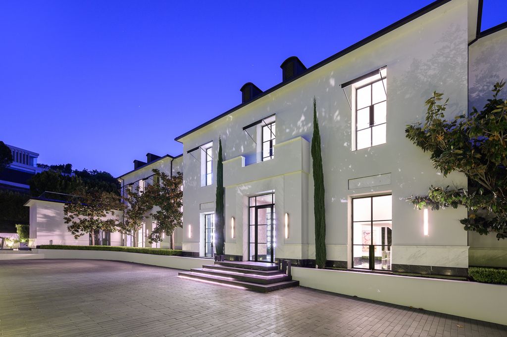 The World Class Trophy Mansion in Los Angeles is a warm contemporary French Manor set in the heart of Old Bel Air now available for sale. This home located at 10701 Bellagio Rd, Los Angeles, California; offering 8 bedrooms and 12 bathrooms with over 24,000 square feet of living spaces.