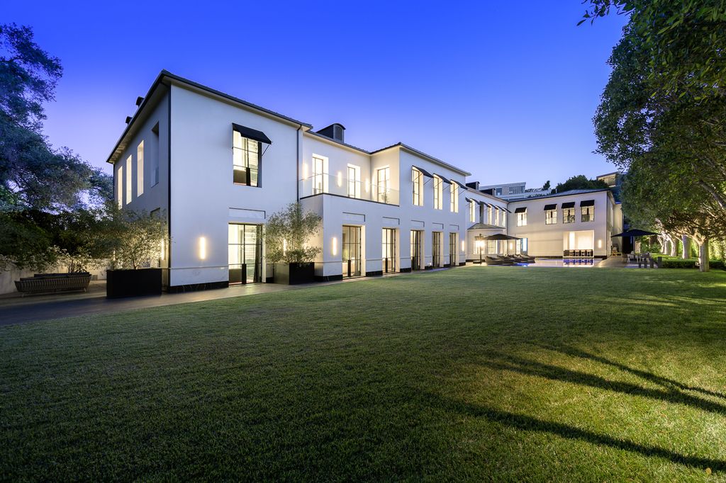 The World Class Trophy Mansion in Los Angeles is a warm contemporary French Manor set in the heart of Old Bel Air now available for sale. This home located at 10701 Bellagio Rd, Los Angeles, California; offering 8 bedrooms and 12 bathrooms with over 24,000 square feet of living spaces.