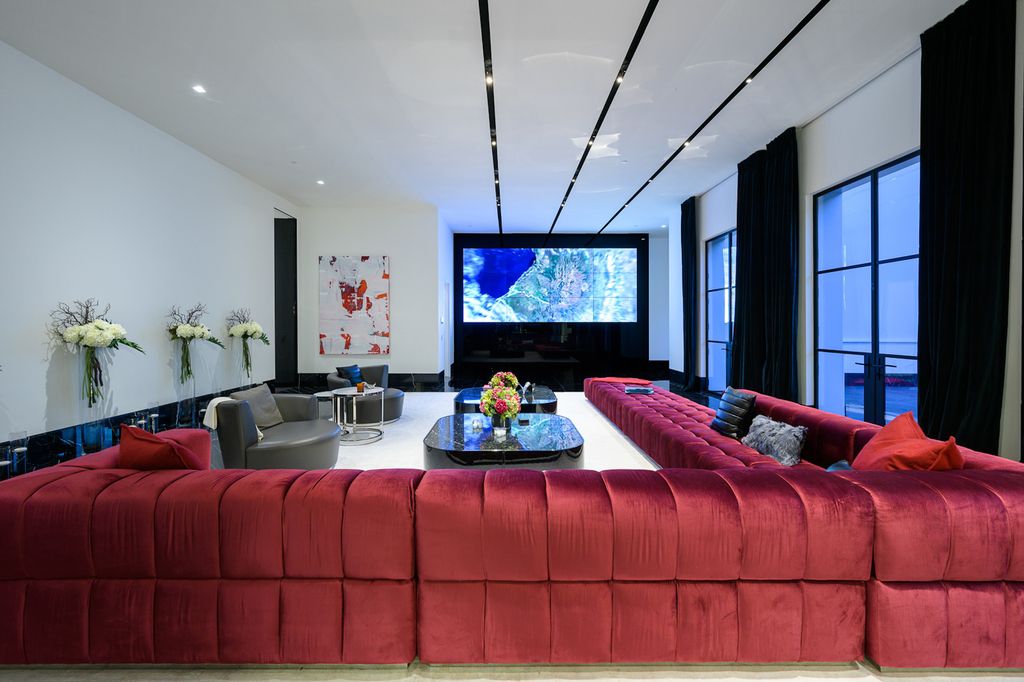 The World Class Trophy Mansion in Los Angeles is a warm contemporary French Manor set in the heart of Old Bel Air now available for sale. This home located at 10701 Bellagio Rd, Los Angeles, California; offering 8 bedrooms and 12 bathrooms with over 24,000 square feet of living spaces.