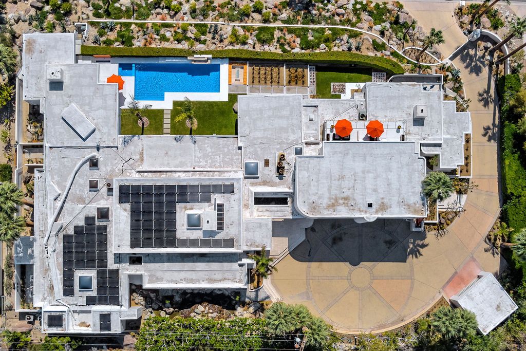 The Palm Springs Hills Modern Home is a iconic estate by John Walling and McCallum with incredible mountain and valley views now available for sale. This home located at 700 W Stevens Rd, Palm Springs, California; offering 6 bedrooms and 8 bathrooms with over 13,000 square feet of living spaces.