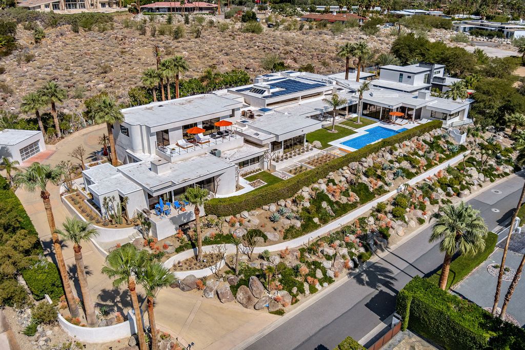 The Palm Springs Hills Modern Home is a iconic estate by John Walling and McCallum with incredible mountain and valley views now available for sale. This home located at 700 W Stevens Rd, Palm Springs, California; offering 6 bedrooms and 8 bathrooms with over 13,000 square feet of living spaces.