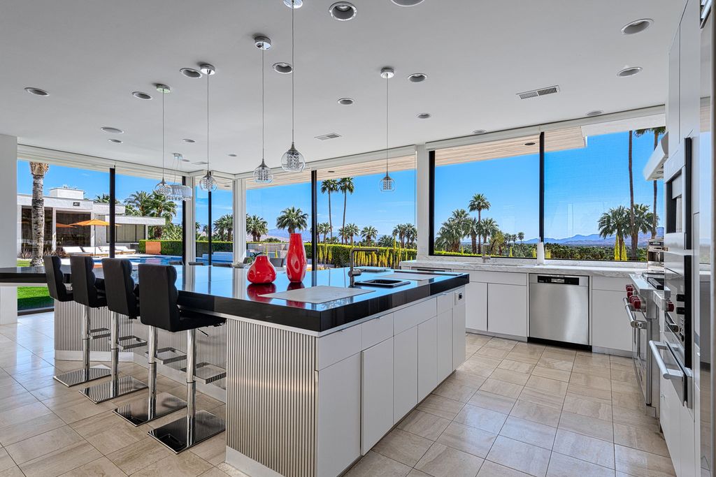 The Palm Springs Hills Modern Home is a iconic estate by John Walling and McCallum with incredible mountain and valley views now available for sale. This home located at 700 W Stevens Rd, Palm Springs, California; offering 6 bedrooms and 8 bathrooms with over 13,000 square feet of living spaces.