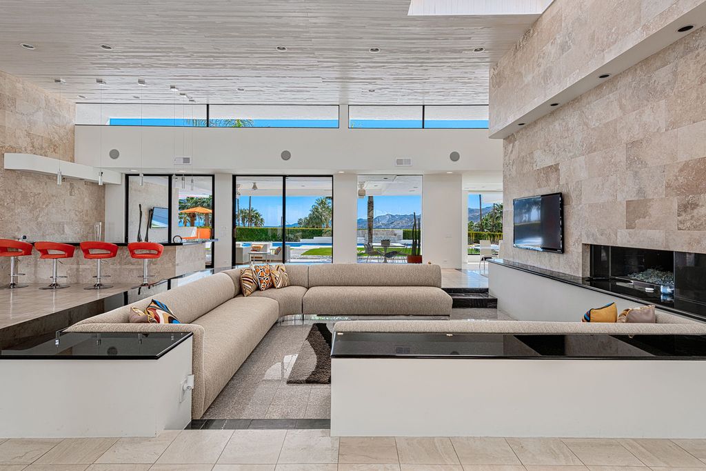 The Palm Springs Hills Modern Home is a iconic estate by John Walling and McCallum with incredible mountain and valley views now available for sale. This home located at 700 W Stevens Rd, Palm Springs, California; offering 6 bedrooms and 8 bathrooms with over 13,000 square feet of living spaces.