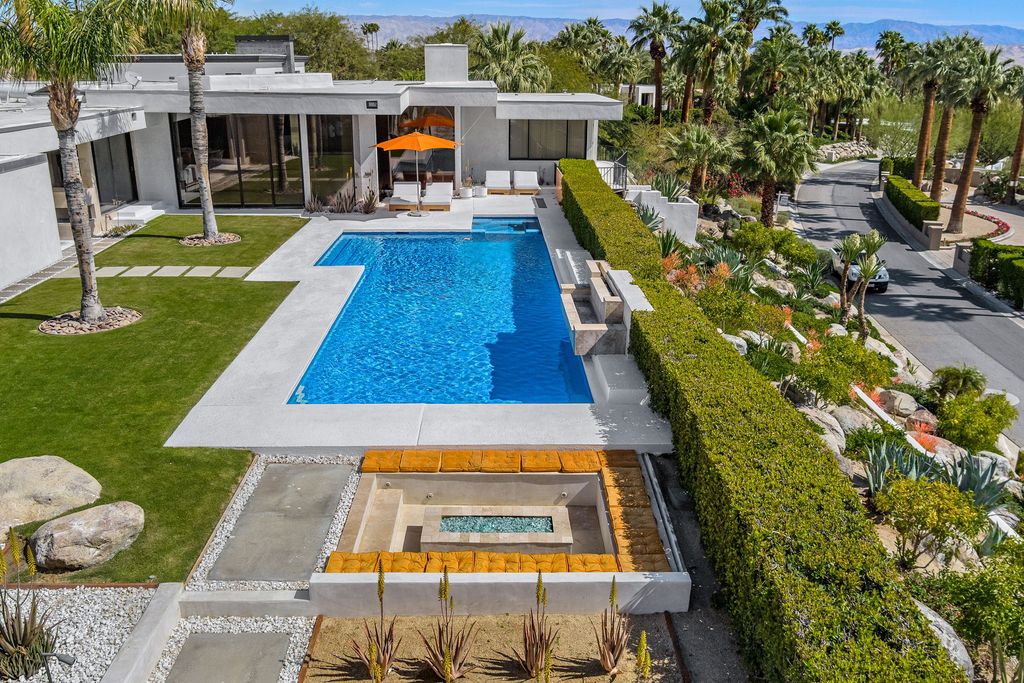 The Palm Springs Hills Modern Home is a iconic estate by John Walling and McCallum with incredible mountain and valley views now available for sale. This home located at 700 W Stevens Rd, Palm Springs, California; offering 6 bedrooms and 8 bathrooms with over 13,000 square feet of living spaces.