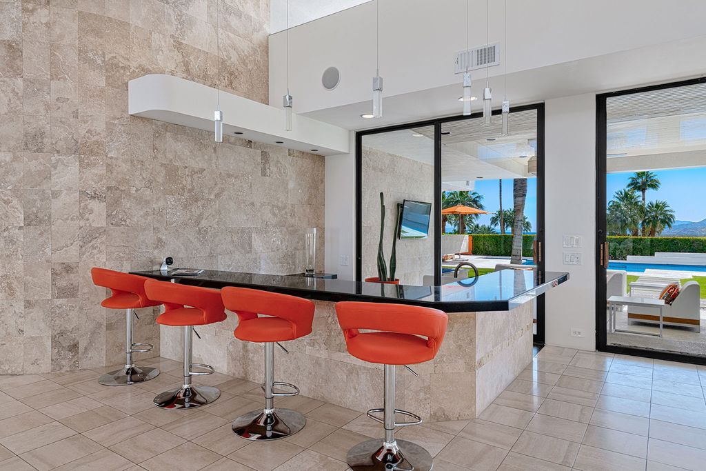 The Palm Springs Hills Modern Home is a iconic estate by John Walling and McCallum with incredible mountain and valley views now available for sale. This home located at 700 W Stevens Rd, Palm Springs, California; offering 6 bedrooms and 8 bathrooms with over 13,000 square feet of living spaces.