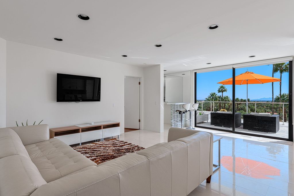 The Palm Springs Hills Modern Home is a iconic estate by John Walling and McCallum with incredible mountain and valley views now available for sale. This home located at 700 W Stevens Rd, Palm Springs, California; offering 6 bedrooms and 8 bathrooms with over 13,000 square feet of living spaces.