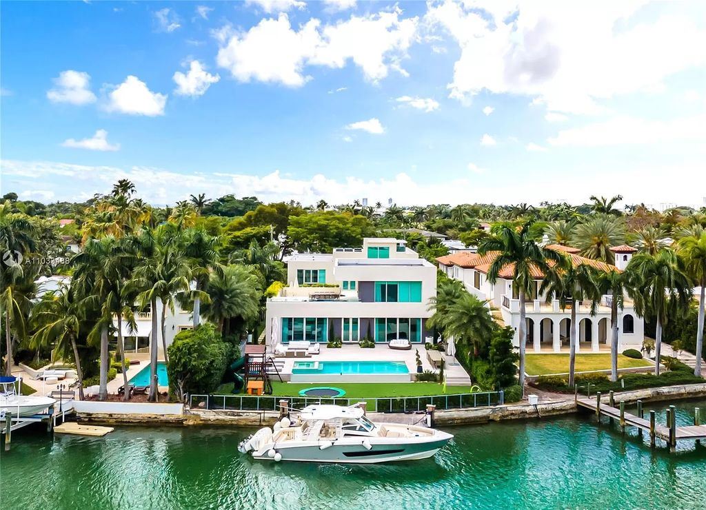 The Modern Waterfront Villa in Miami Beach is a luxurious home on Pine Tree Drive ideal for entertaining now available for sale. This home located at 5711 Pine Tree Dr, Miami Beach, Florida; offering 7 bedrooms and 9 bathrooms with over 8,000 square feet of living spaces.