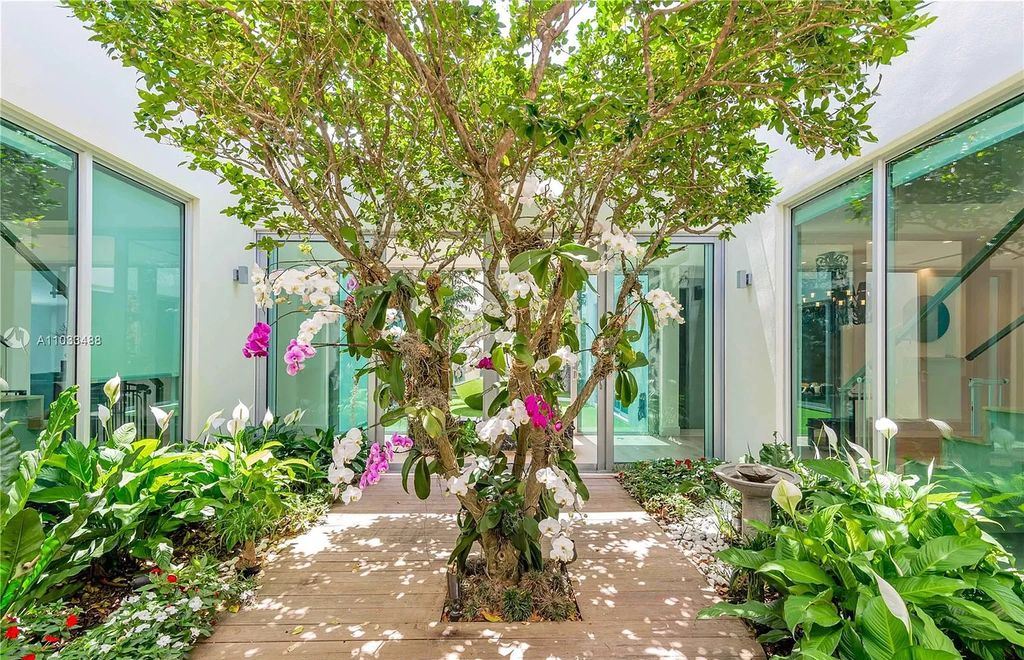The Modern Waterfront Villa in Miami Beach is a luxurious home on Pine Tree Drive ideal for entertaining now available for sale. This home located at 5711 Pine Tree Dr, Miami Beach, Florida; offering 7 bedrooms and 9 bathrooms with over 8,000 square feet of living spaces.