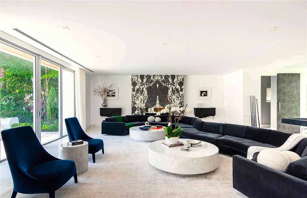 The Modern Waterfront Villa in Miami Beach is a luxurious home on Pine Tree Drive ideal for entertaining now available for sale. This home located at 5711 Pine Tree Dr, Miami Beach, Florida; offering 7 bedrooms and 9 bathrooms with over 8,000 square feet of living spaces.