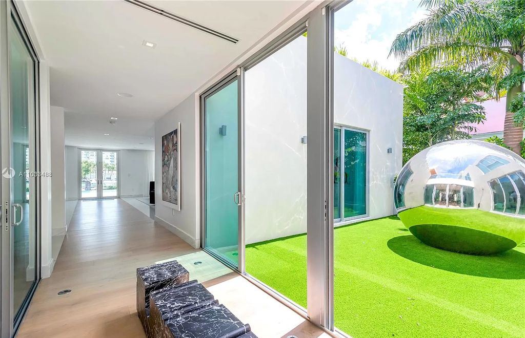 The Modern Waterfront Villa in Miami Beach is a luxurious home on Pine Tree Drive ideal for entertaining now available for sale. This home located at 5711 Pine Tree Dr, Miami Beach, Florida; offering 7 bedrooms and 9 bathrooms with over 8,000 square feet of living spaces.
