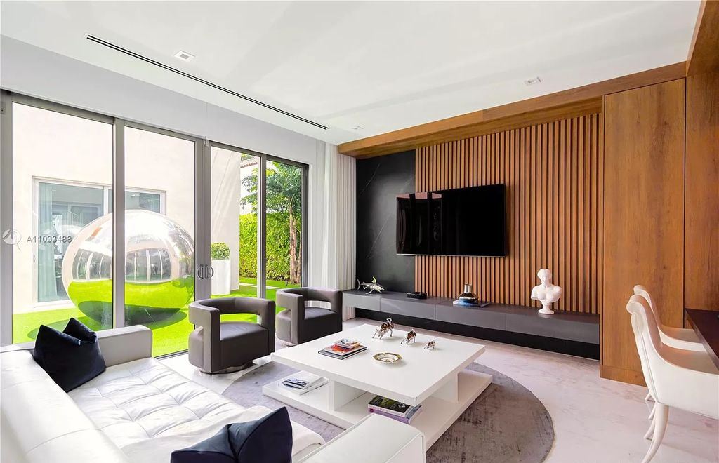 The Modern Waterfront Villa in Miami Beach is a luxurious home on Pine Tree Drive ideal for entertaining now available for sale. This home located at 5711 Pine Tree Dr, Miami Beach, Florida; offering 7 bedrooms and 9 bathrooms with over 8,000 square feet of living spaces.