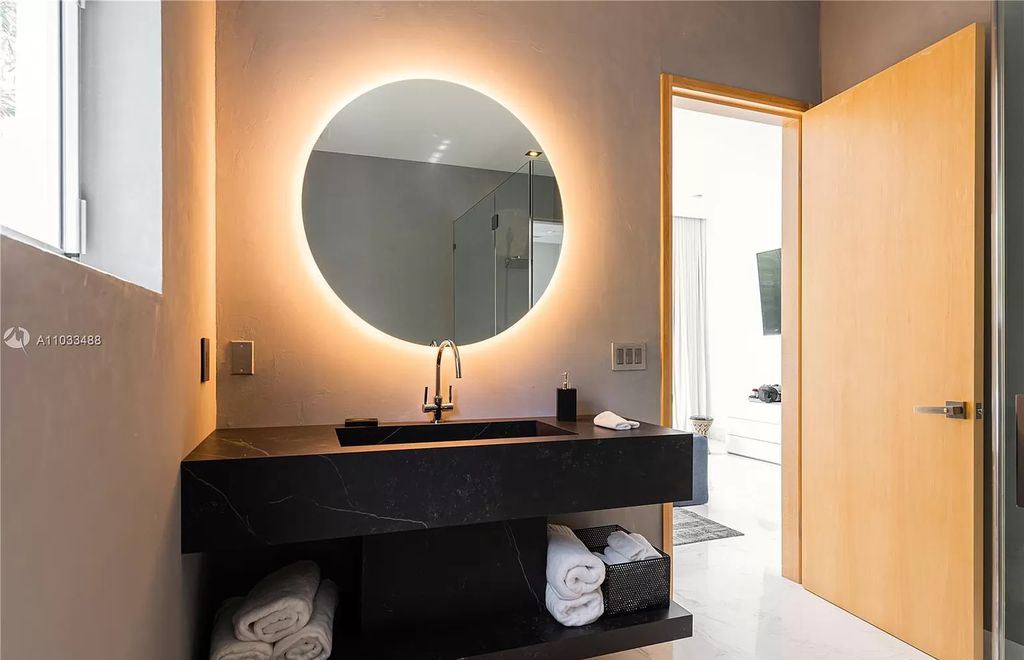 The Modern Waterfront Villa in Miami Beach is a luxurious home on Pine Tree Drive ideal for entertaining now available for sale. This home located at 5711 Pine Tree Dr, Miami Beach, Florida; offering 7 bedrooms and 9 bathrooms with over 8,000 square feet of living spaces.