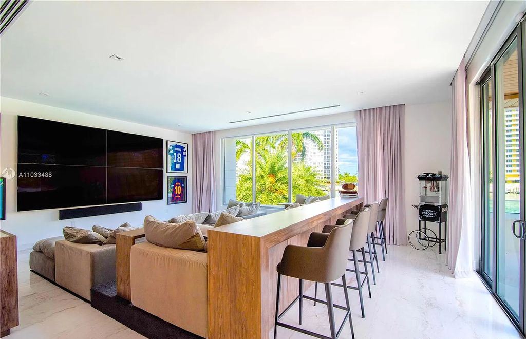 The Modern Waterfront Villa in Miami Beach is a luxurious home on Pine Tree Drive ideal for entertaining now available for sale. This home located at 5711 Pine Tree Dr, Miami Beach, Florida; offering 7 bedrooms and 9 bathrooms with over 8,000 square feet of living spaces.